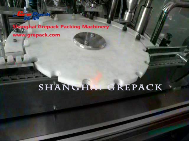 Small bottle filling and capping machine