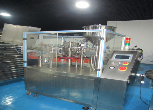 Automatic tube filling and sealing machine