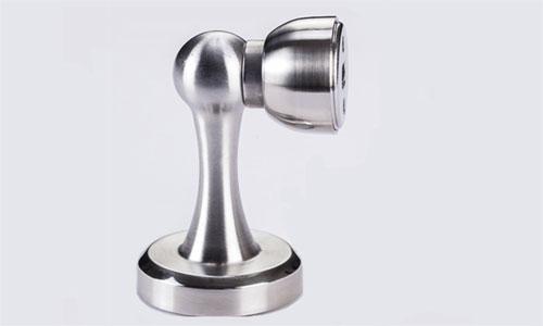 Corner magnetic door stop with catch