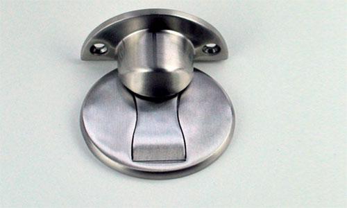 Floor mounted invisible door stop